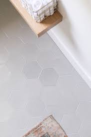 As a modern, enlarged deviation from the classic hexagon mosaic, this tile option is a throwback to traditional retro design with a contemporary feel. My Charming Bathroom Reveal Sugar And Charm Grey Bathroom Floor White Bathroom Tiles Light Grey Bathrooms