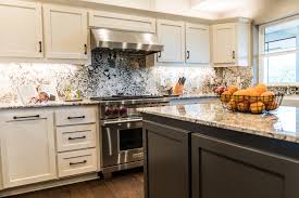 More than just storage for pots and plates, cabinetry defines the look of your cook space. White Granite Kitchen Remodel Lawson Construction
