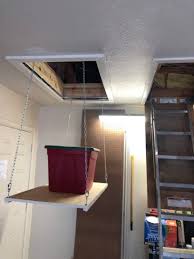 Diy network offers smart solutions for storing large items, like bikes, kayaks and surfboards, in the garage. Garage Attic Storage Lift Plano Texas Handyman