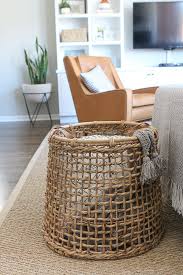 The Right Way To Display Throw Blankets On Your Couch The Diy Playbook Living Room Blanket Living Room Baskets Living Room Diy