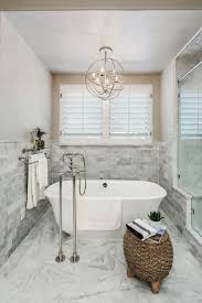 Cast iron or stone tubs are traditional and can be very attractive, but they're also it's possible to mount a shower over your freestanding tub, but then you have less choice in the tub's positioning. 30 Amazing Bathroom Chandeliers For Your Home Ceplukan Modern Bathroom Modern Bathroom Tile Tile Bathroom