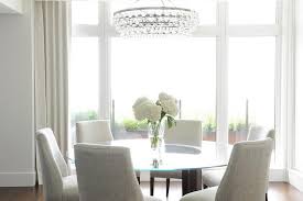The chandelier can be hung up to 24 from the ceiling on an adjustable chain. Oval Bling Chandelier With Oval Glass Top Dining Table Transitional Dining Room