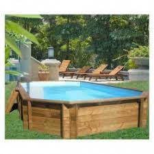 When the temperatures climb, they enjoy refreshing in the trough pool they updated in 2015 with a pea gravel patio, potted flowers, and a wooden deck for easy access. Wooden Swimming Pool C Piscine