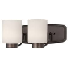 With elements of industrial, modern and retro, a dark bronze finish completes the well crafted design. Modern Bathroom Light In Bronze Finish With Cylinder Glass Shades