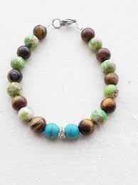 This Blue Green And Brown Stone Bracelet Is Made From Green Emporer Stone Tigers Eye And Blue Turquoise Beads On Eye Earrings Shop Earrings Stone Bracelet