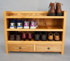 This shoe organizer consists of two long boards with a series of small shelves connecting them. Pin On Handmade By Ogw