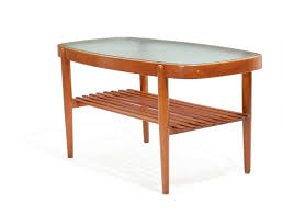 First of all these pieces of furniture are considered to be the safest and most environmentally friendly ones. Lot Art Not Sold Eva Koppel Nils Koppel Oval Beech Coffee Table With Glass Top Manufactured By