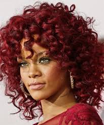 Rihanna seems to be changing the woman hairstyles so many times that it's growing to be hard for people to remember all of them. Rihanna Medium Curly Red Hairstyle