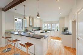 Seating can accommodate anywhere from one to four people, depending on the size of your kitchen and the style of seating you are seeking. 30 Kitchens With Two Tier Islands Nice Feature Home Stratosphere