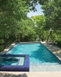 A Wooded 2 Acre Lot Gave This Landscape Designer The Perfect Backdrop For A Peaceful Pool And Patio See The Amazing Oasis Tha Pool Patio Landscape Design Pool