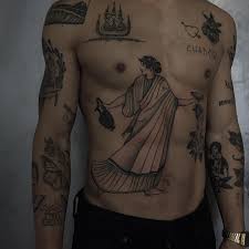 Guitar is probably the most popular musical instrument so no wonder many guys love to have guitar tattoos like this on their body. Men Rock Tatto