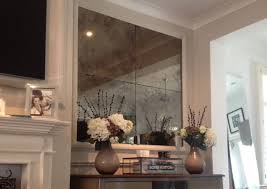 This mirror features a narrow metal frame finished in heavily antiqued rustic bronze with antiqued style mirrors. Bronze Vintage Antique Mirror Saligo Design
