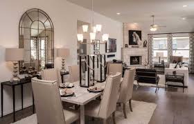 This Open Floor Plan Lets The Dining Room And Kitchen Flow Right Into The Stylish Living Area Living Room Dining Room Combo Condo Living Room Dining Room Combo