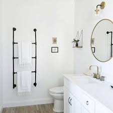 Get the best deals on wall mounted towel rack towel racks. Bathroom Inspiration That Showcases A Black Metal Towel Rack Minimal White Towels White Vanity With White Co Trendy Bathroom Bathrooms Remodel Black Bathroom