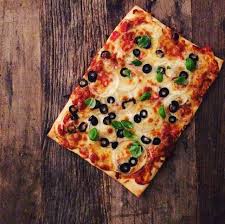 Homemade Pizza On Pizza Stone Familiedeig Tomato Sauce Mozarella Olive Oil Chorizo Pineapple Banana Pepper Olives Feta Cheese Pesto Artichoke