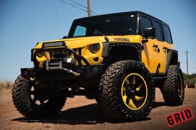 I used to run those directionals on my ford truck. Bossy Yellow Lifted Jeep Wrangler Shod In Grid Off Road Wheels Carid Com Gallery