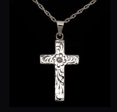 This large sterling silver oval locket features an intricately hand graved floral design with four points on the front and a single chevron on the back. Sterling Silver Floral Pattern Cross Cappetta S West Suburban Funeral Home