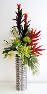 Decorating Table Centerpiece Using Red And Green Artificial Flower Arrang Flower Vase Arrangements Artificial Flower Arrangements Tropical Flower Arrangements