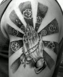 A big praying hands tattoo with roses, dove, and other details also on the chest for men. Praying Hand And Roses Tattoo