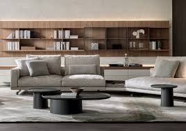 The tabletops, a bit like suspended trays, come in ash or brick red cement or in eucalyptus wood and feature an original radial motif, achieved by means of a special procedure for joining up the slabs. Coffee Tables Louisa Molteni C