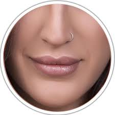 Multiple facial piercings and jewelry