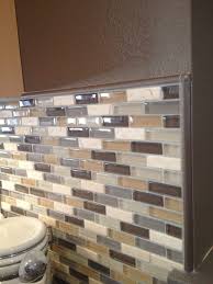 Glass Mosaic Backsplash In Neutral Colors Complete With Schluter Edge Profile Pieces Kitchen Tiles Backsplash Kitchen Backsplash Designs Glass Tile Backsplash