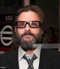 Is Manu Bennett's real name John Bennett?