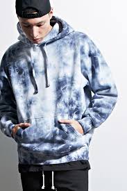 Black And Blue Tie Dye Hoodie A Fleece Knit Hoodie By Eptm Trade Featuring An Allover Tie Dye Design A Drawstring Neckline A Kangaroo Pocket Tie Dye Outfits Tie Dye Hoodie Tie Dye Men