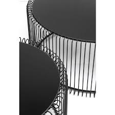 The black, finely drawn round frame with slender metal rods supports a table top of deep black glass. Coffee Table Wire Black 2 Set Kare Design