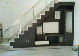 For those don't want to have the supports for their stairs to be just blank, one cool and interesting choice you might make is to add a backdrop. Railing Space Covered Tv Unit Furniture Design Living Room Tv Unit Designs Stairs Design