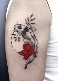 Here is another lotus japanese tattoo where the artist added two koi fishes around the collar bone and the flower on the middle of the chest. Koi And Red Flowers Tattoo Inkstylemag Red Tattoos Red Flower Tattoos Tattoos