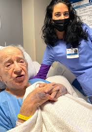 These two are like peas in a pod! ❤️🇺🇸🙌🏻 Our nurse assistant Erica has  the honor of caring for Mr. Charles, a WWII veteran who is 98-years YOUNG!  He's been singing "The