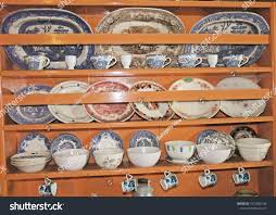 old antique kitchen dresser cups plates