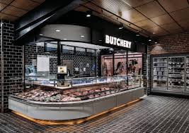 A Modified Italian Apeliono Features In The Entry Of The Store Which Is Used For Visual Merchandising And D Meat Store Grocery Store Design Supermarket Design