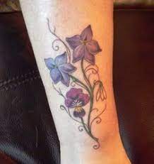 Perhaps Something Like This Larkspur For Me And Snowdrop For Jacob Can Add On Later Violet Tattoo Tattoos Violet Flower Tattoos