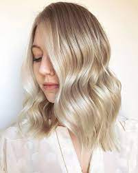 Super Shiny Baby Vanilla Blonde Aveda Hair Color Paired With A Wavy Long Lob Haircut By Aveda Artist Kailyn Aveda Hair Color Beige Blonde Hair Blonde Hair Care