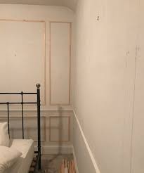Consider using wood panels on one wall to create a unique visual accent in your bedroom. Wall Panelling Tutorial The House That Black Built