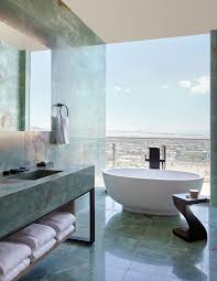 Mosaic flooring prevents slippage and adds texture to this simple bathroom design. 30 Perfect Bathrooms With Luxurious Curved Tubs Round Bathtub Ideas