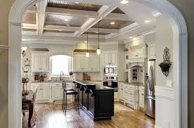A glamorous white ceiling, walls, and cabinets contrast with the dark wood of the kitchen island. White Cabinet Black Island Houzz