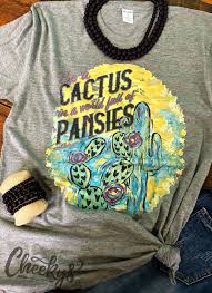 It is definitely an entirely different world. Be A Cactus In A World Of Pansies Teeshirt Screenprinting Cactus Pansies Countrygirl Desertgi Types Of Fashion Styles Country Style Outfits Popular Shirt