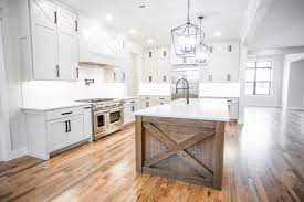 Coming in from the front porch you are greeted by a large open living space with views into the kitchen, dining , and rear porch. The Rustic Modern Farmhouse Kitchen Dallas By House Sprucing Houzz