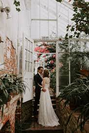 Here a bride and groom hold hands up against a brick wall at a wedding venue in waltham ma. Theresa And Kyle S Romantic Greenhouse Wedding At The Lyman Estate Boston Wedding Photographer Madeline Rose Photography Co