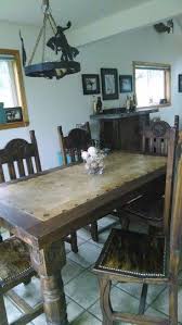 The star dining table has a solid ash wood base with a walnut stain. Wedding Present Western Dining Room Table Gone Country Western Texas Star Accents Tile Top Brindle Cowhide Cha Western Dining Room Home Decor Tile Table