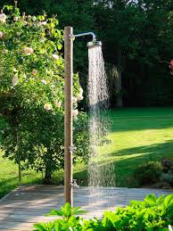 Create a garden shower using a watering can or a bucket with tiny holes drilled through the bottom. 10 Easy Pieces Freestanding Outdoor Showers Gardenista