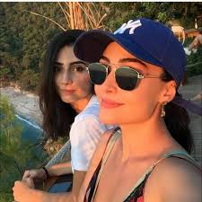 image may contain one or more people sunglasses outdoor and nature sunglasses mirrored sunglasses women sunglasses women