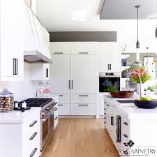 Industrial loft kitchen with black countertops, black cabinet hardware, black range hood and black ceiling. Ciuffo Cabinetry On Twitter Soft Bright Contemporary Design Clean White Slab Cabinets Contrasted With Matte Black Hardware And A Fabulous Metal Strapped Hood In Our Custom Kitchen Ciuffocabinetry Customcabinets Kitchencabinets Kitchen