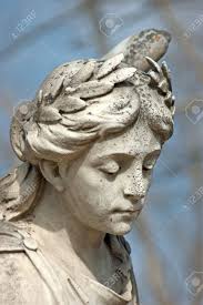 A Stone Statue Of An Angel With Blurred Background. Stock Photo, Picture  and Royalty Free Image. Image 9294558.