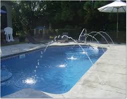 Essentially, there are water lines in your pool deck (flush with the surface) that shoot out streams of water into the pool of varying heights, depending on the installation. Accurate Pool And Spas Pool Water Features Watertown Wisconsin