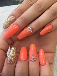 Fabulous matte nail designs ideas to try this fall. Hot Orange Colors And Rhinestone Designs Orange Acrylic Nails Orange Nail Designs Rhinestone Nails