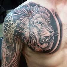 Black color lion tattoo with crown on near elbow. 125 Best Lion Tattoos For Men Cool Designs Ideas 2021 Guide